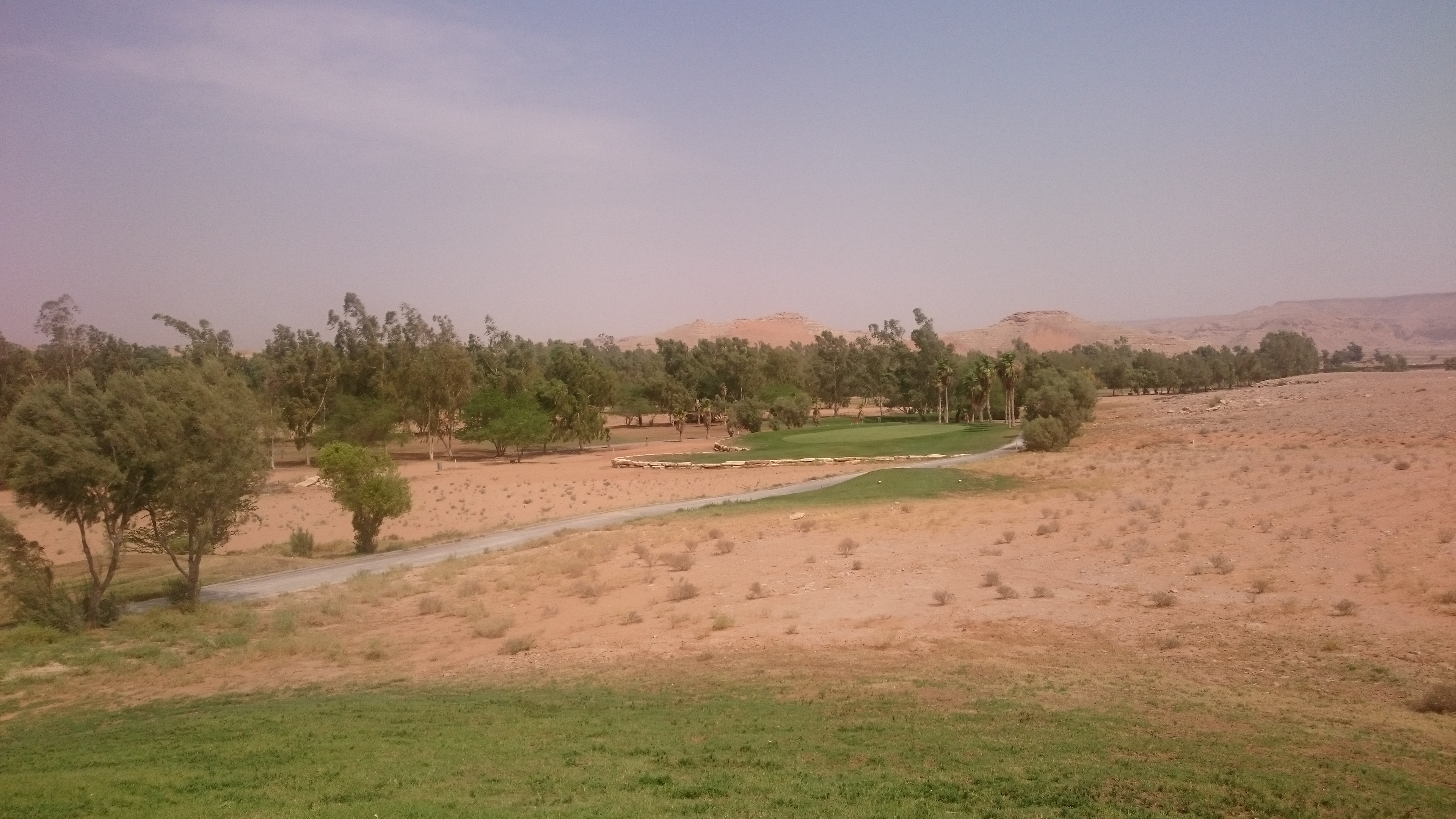 A mixture of sand and grass for one of the par 3s at Dirab Golf Club