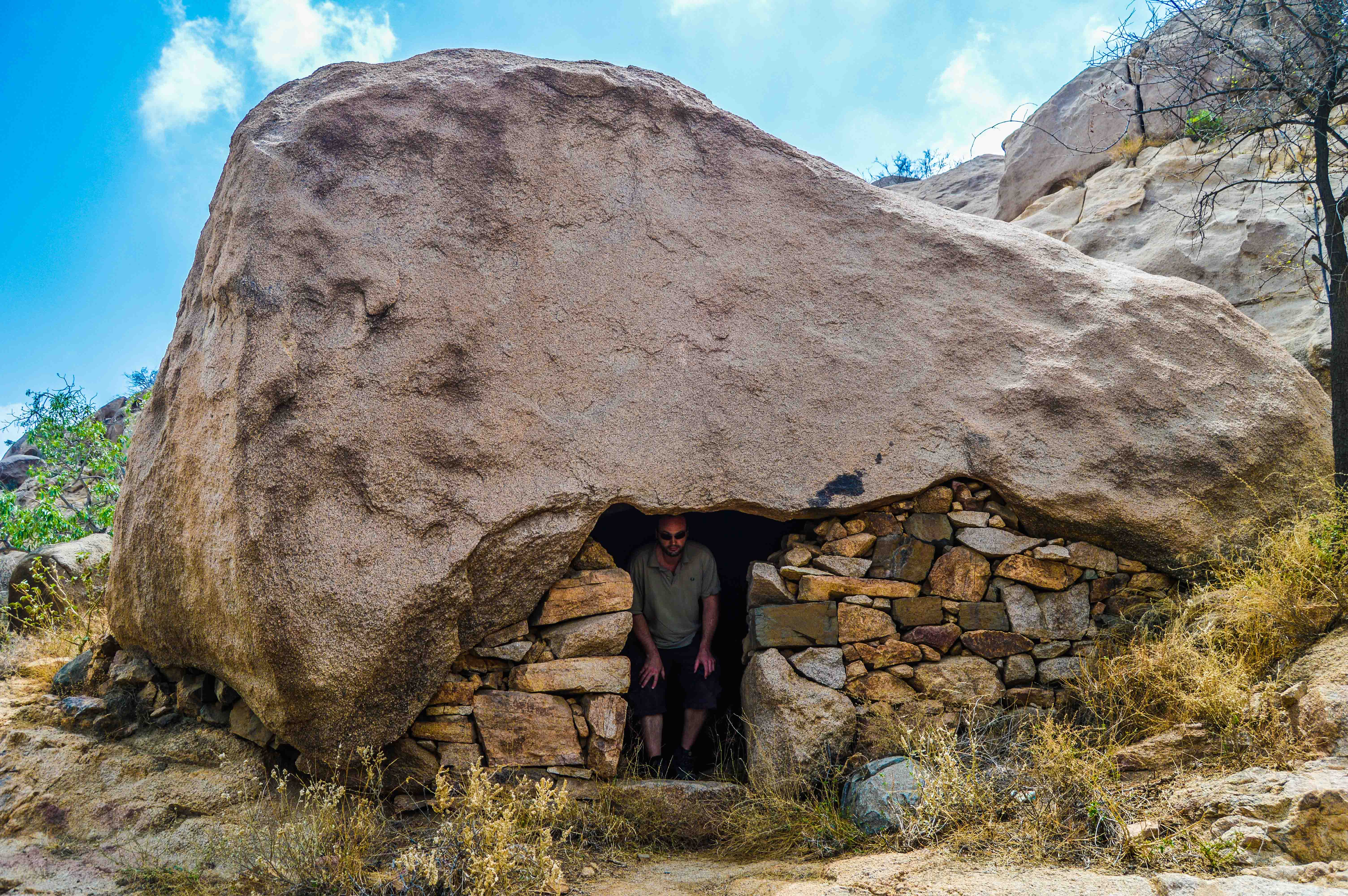 Florent Egal visiting one of the stone made house on the way to Sheda (photo: Alan Morrissey)